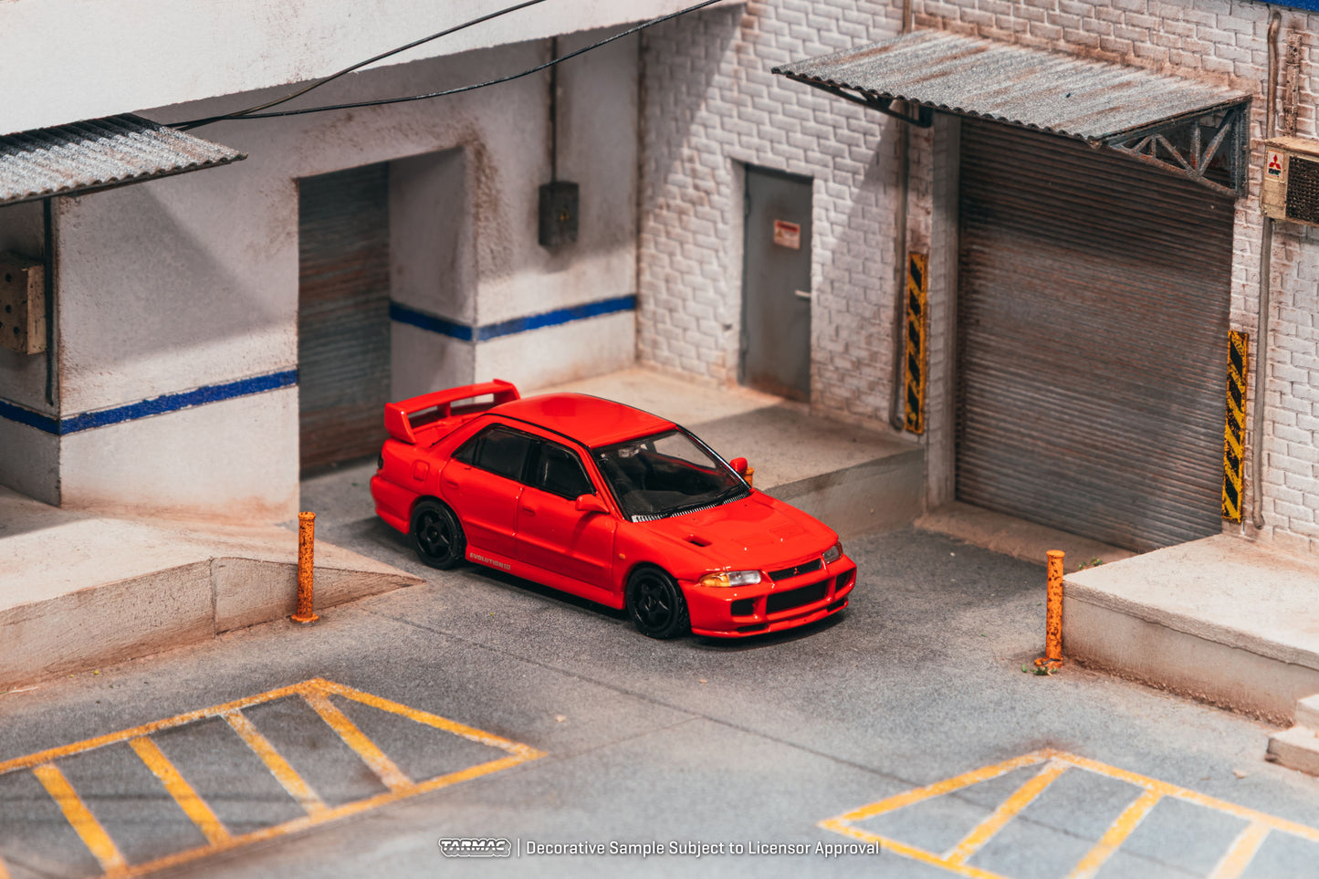 Tarmac Works Global64 Mitsubishi Lancer GSR Evolution III in red.