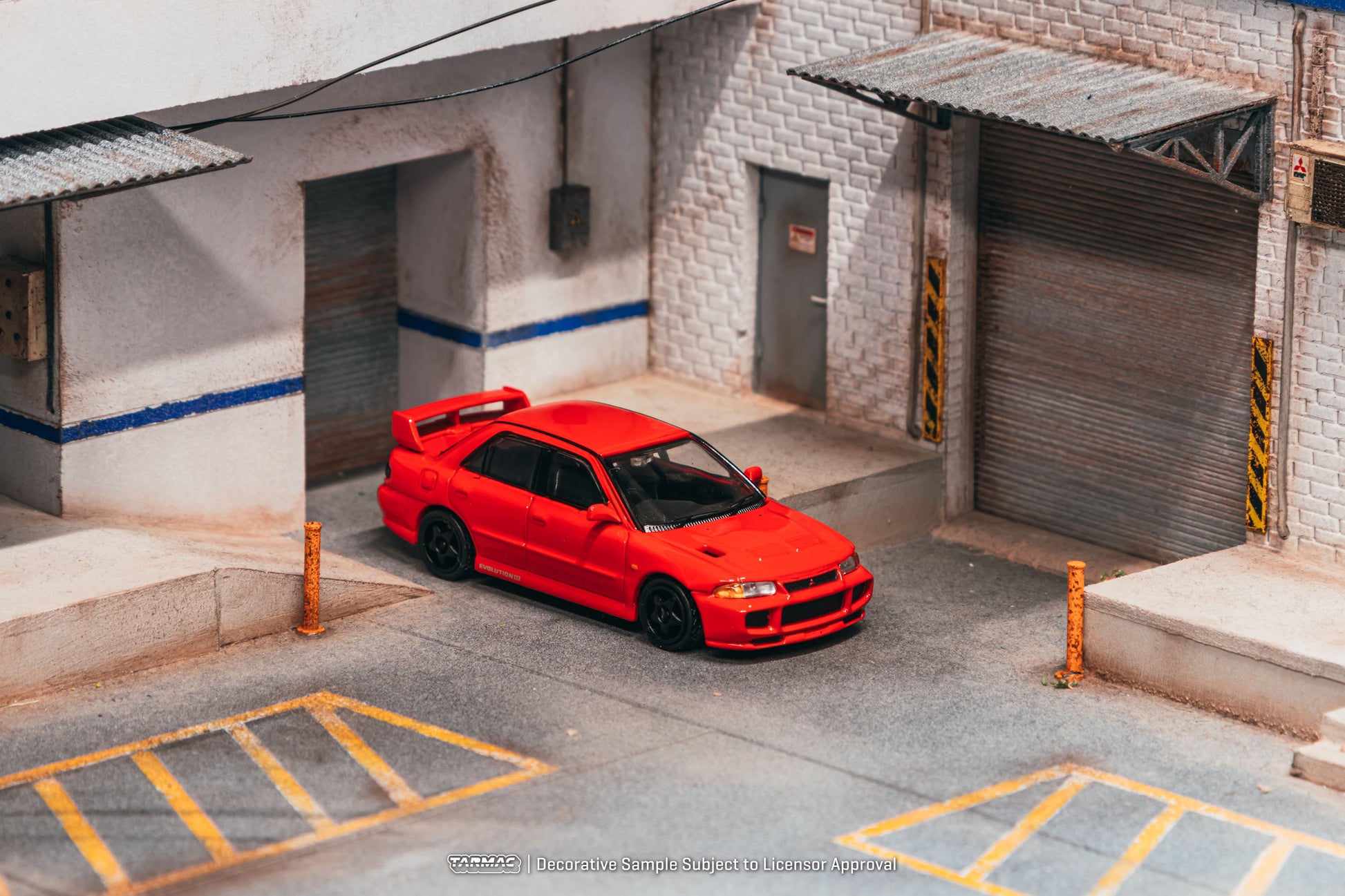 Tarmac Works Global64 Mitsubishi Lancer GSR Evolution III in red.