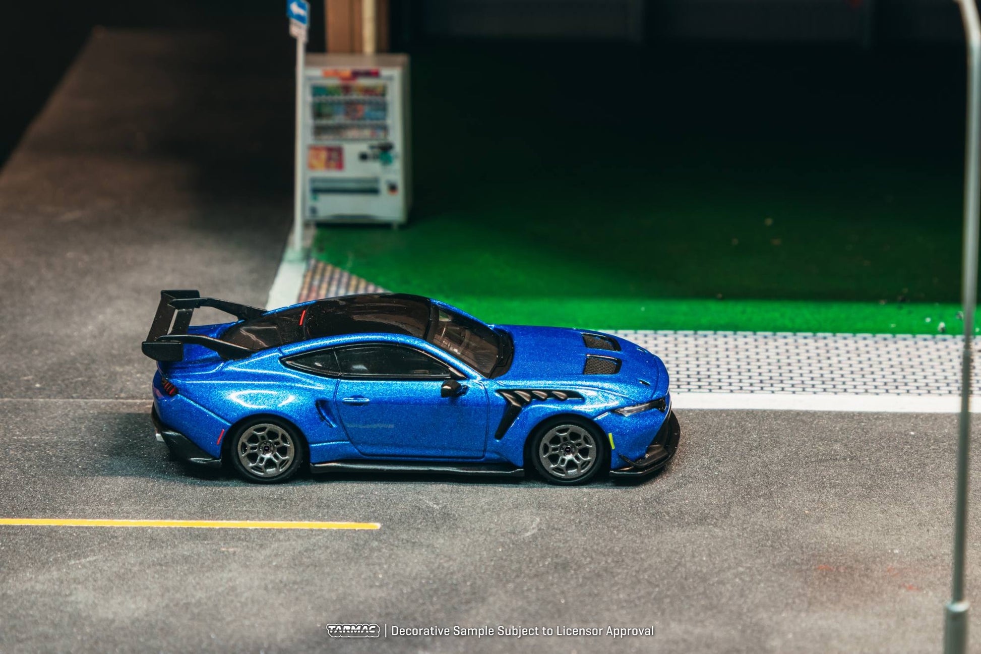 Tarmac Works 1:64 Ford Mustang GTD blue GT3 inspired diecast model with large rear wing. Side