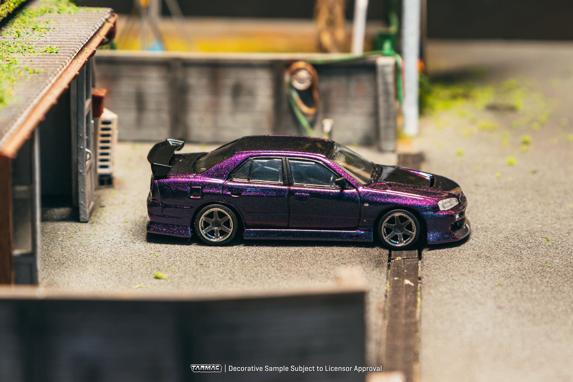 Tarmac Works Nissan Skyline ER34 URAS in Midnight Purple from the Global64 collection. Side