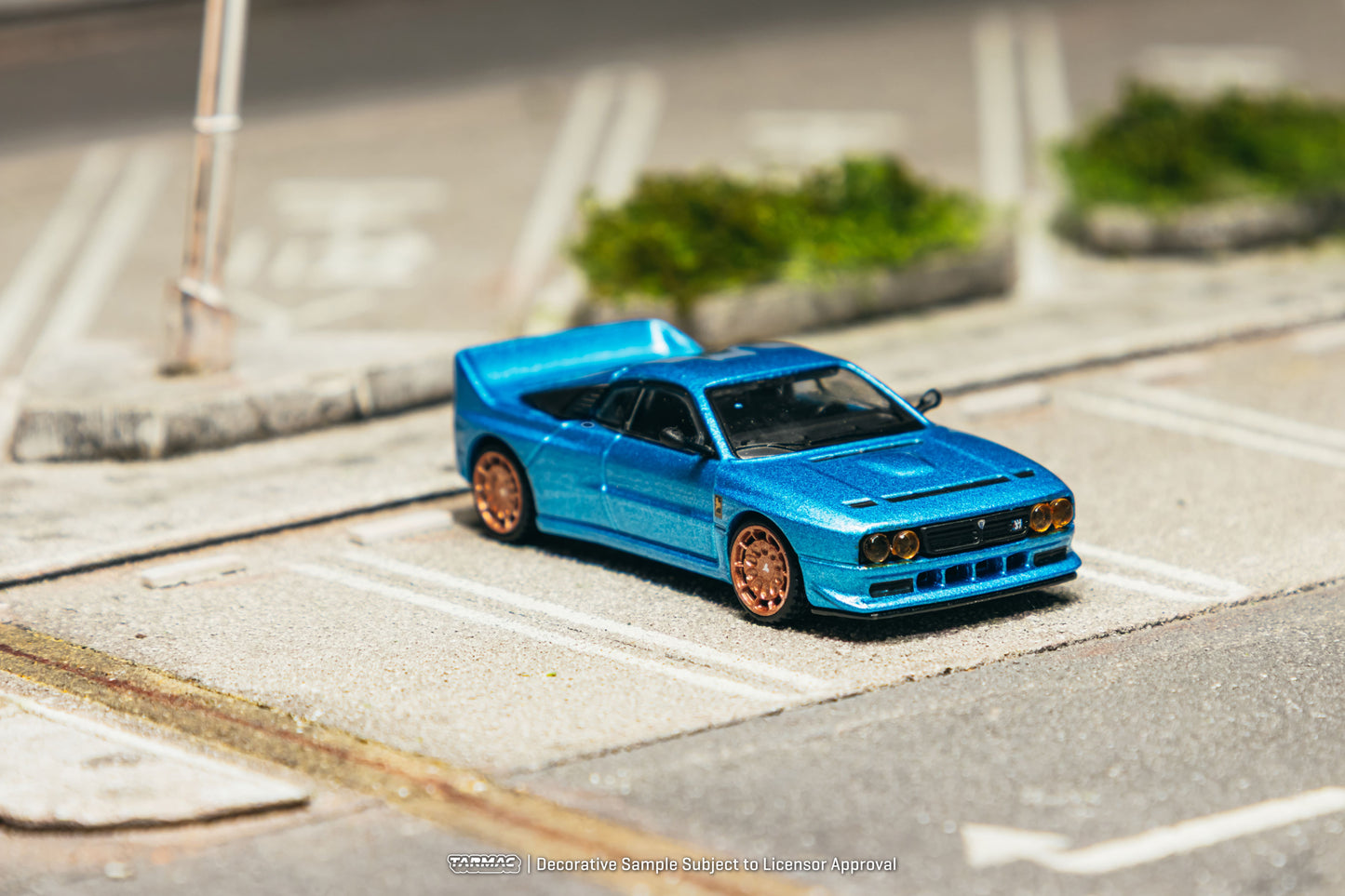 Tarmac Works Global64 Kimera EVO37 in blue with rolling wheels.