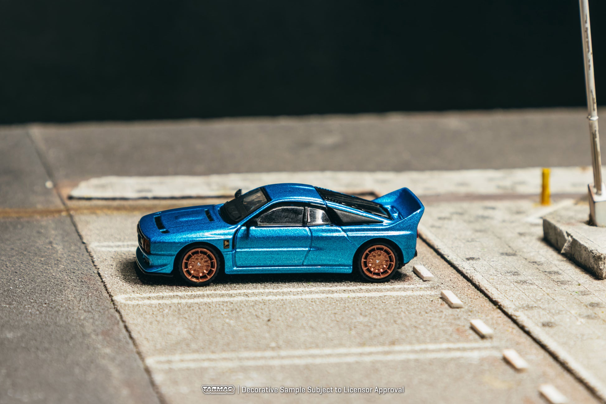 Tarmac Works Global64 Kimera EVO37 in blue with rolling wheels.