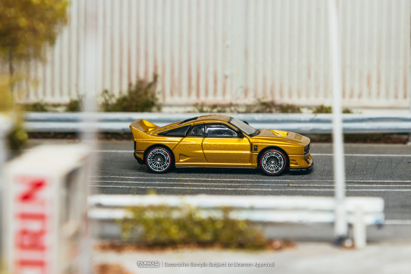 Tarmac Works Kimera EVO38 in gold from the Global64 collection. Side