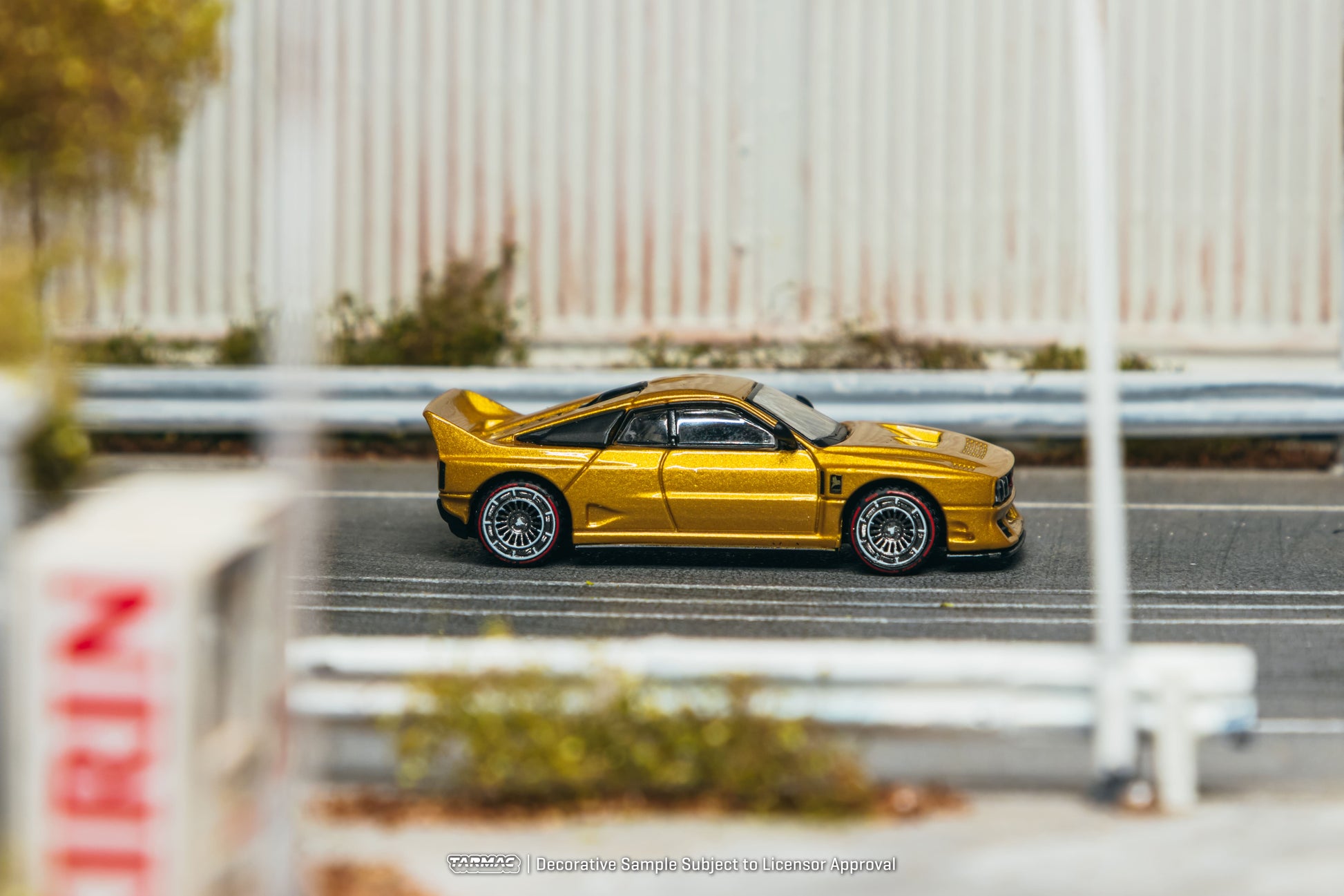 Tarmac Works Kimera EVO38 in gold from the Global64 collection. Side