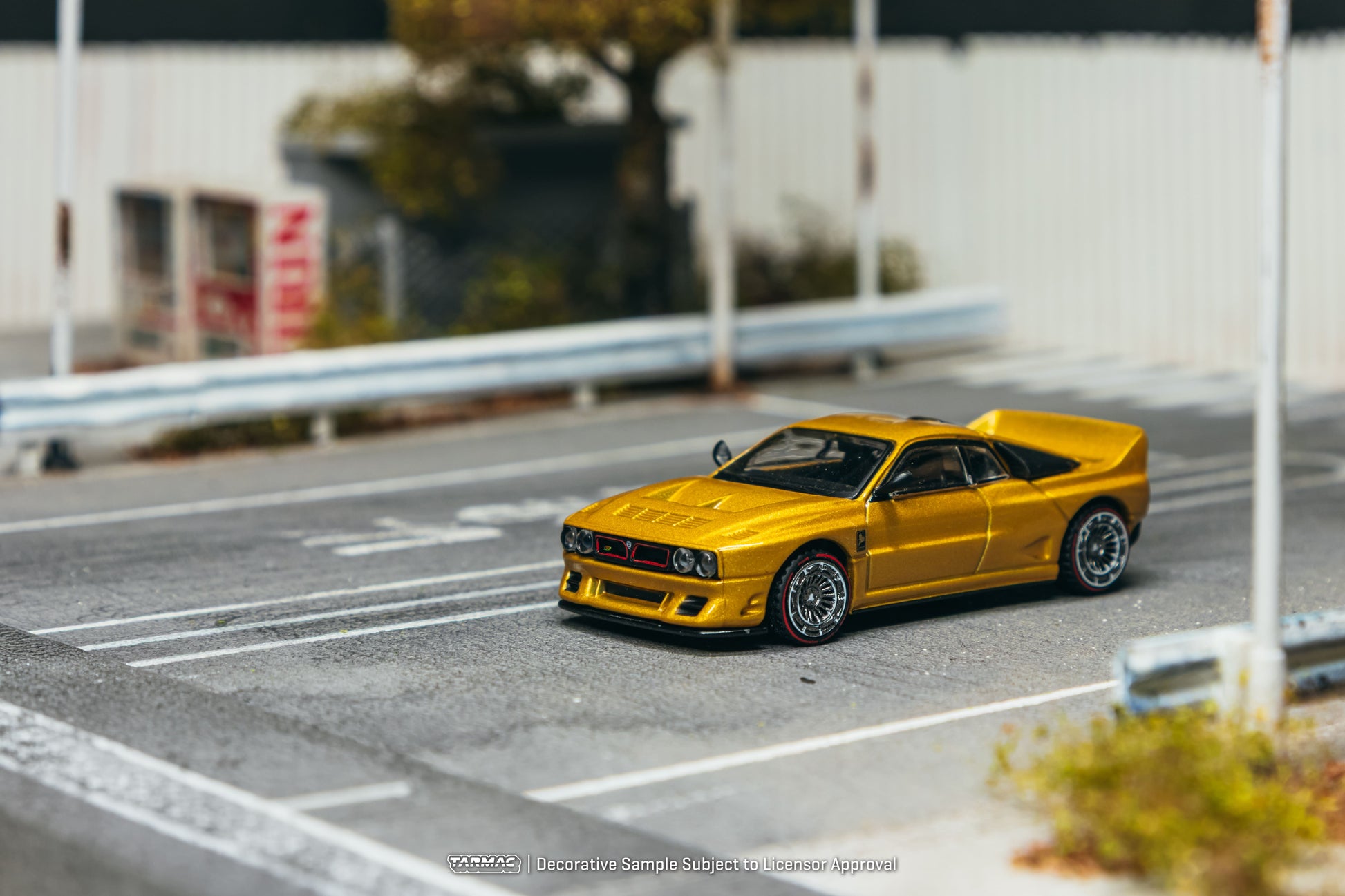 Tarmac Works Kimera EVO38 in gold from the Global64 collection. Front