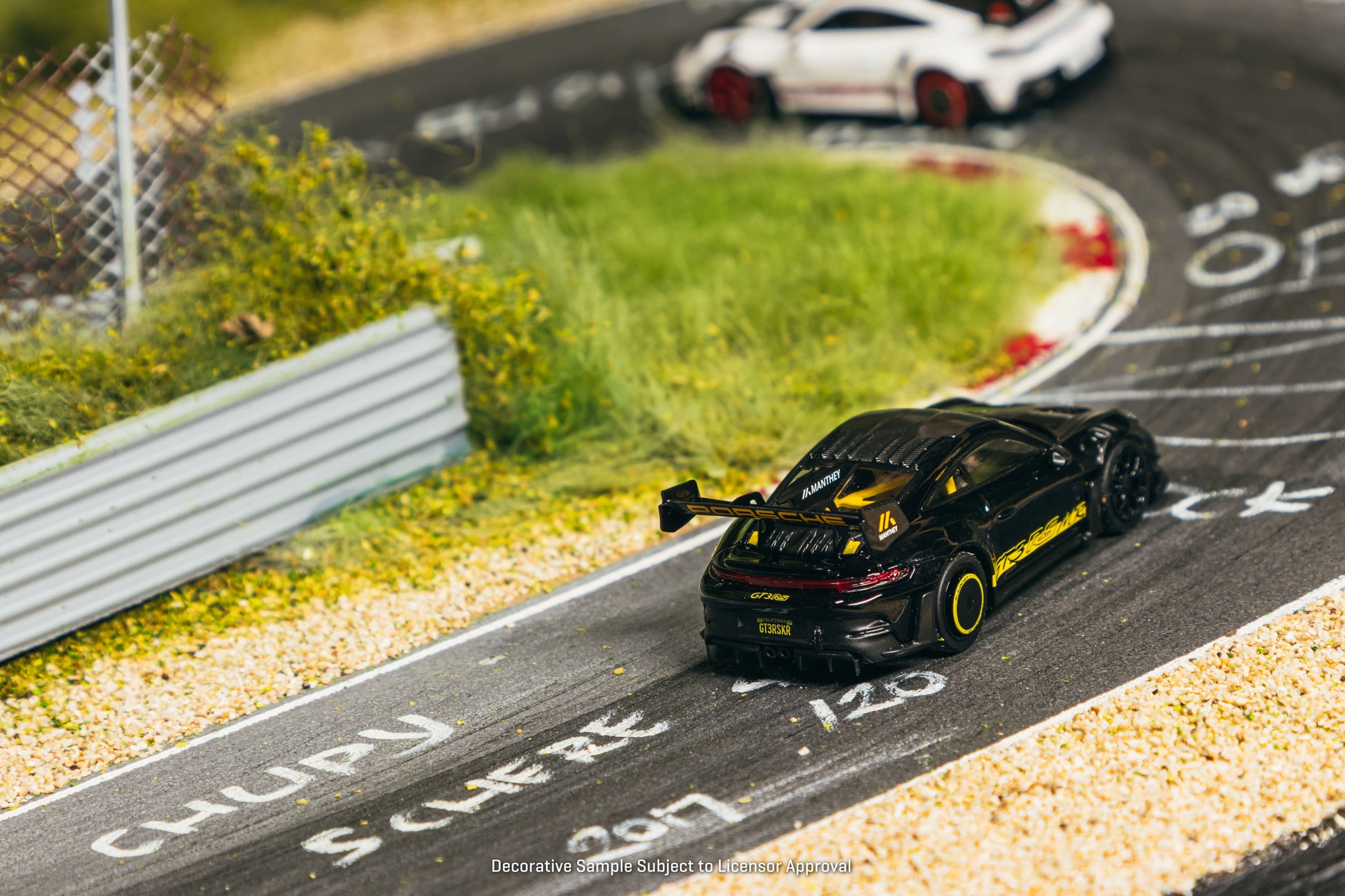 Tarmac Works Porsche 911 GT3 RS 992.1 MR in black and yellow from the Collab64 series. Back