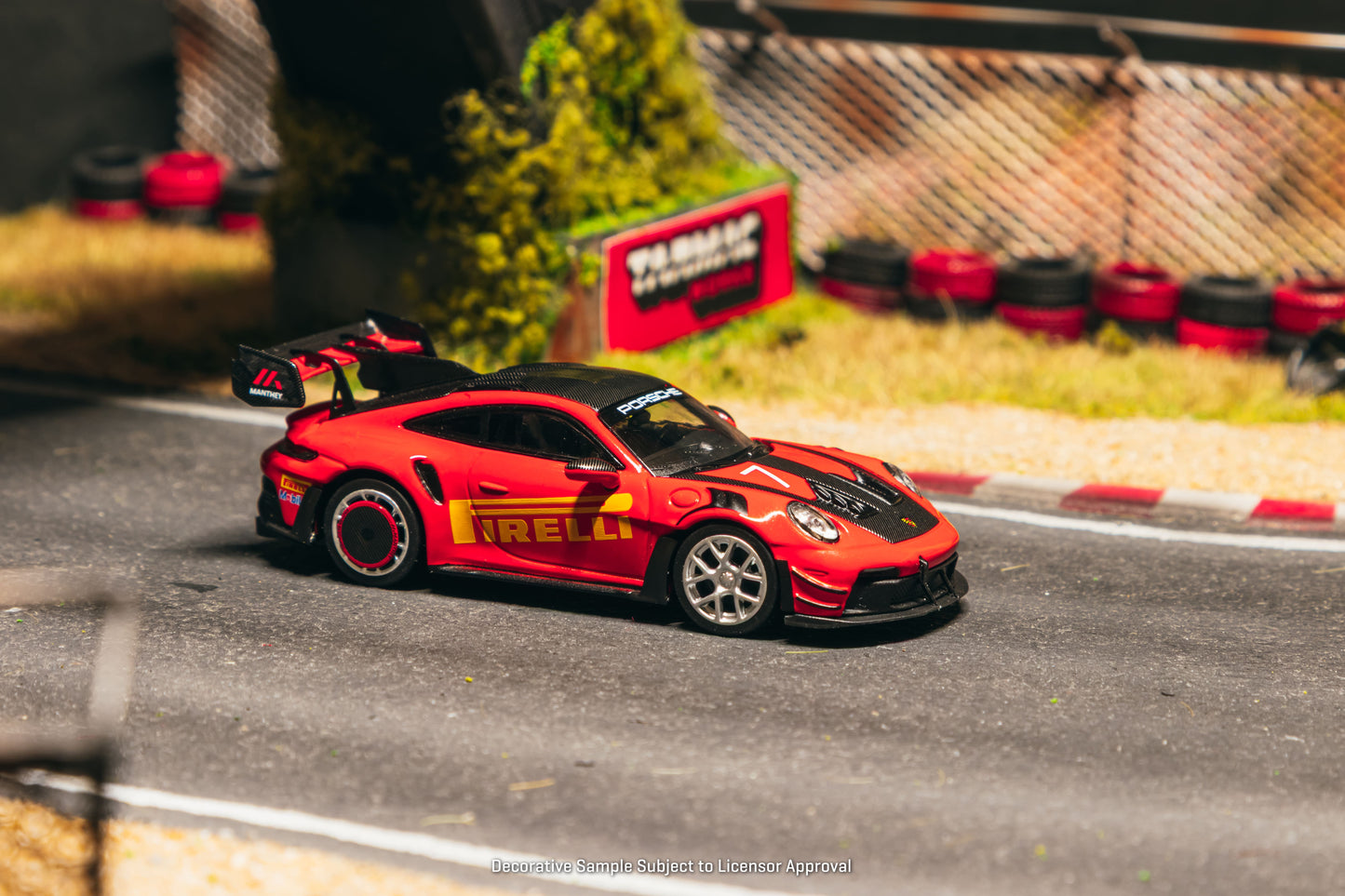 Tarmac Works Collab64 Porsche 911 GT3 RS Manthey Racing in red.