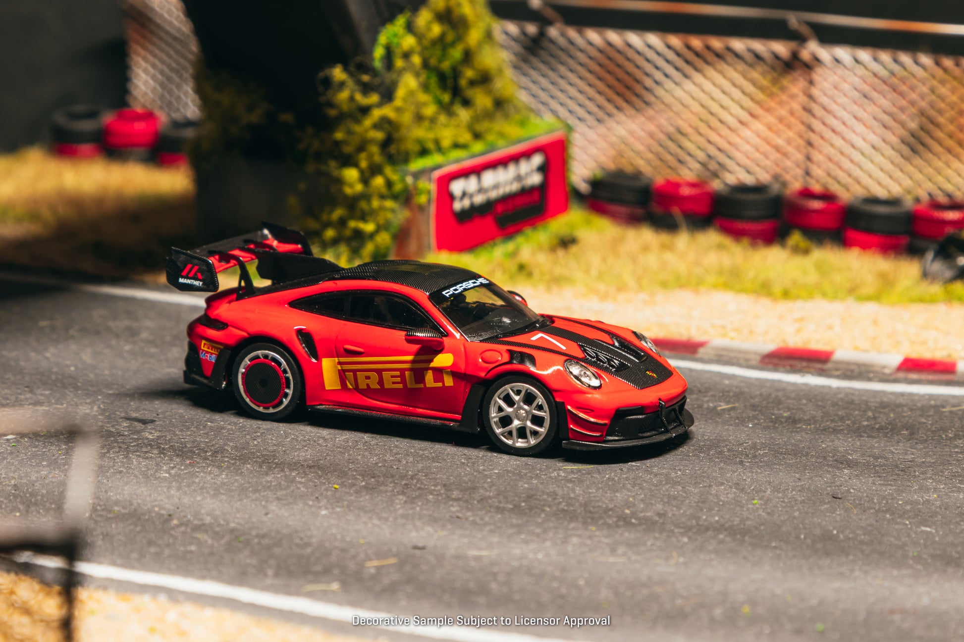 Tarmac Works Collab64 Porsche 911 GT3 RS Manthey Racing in red.