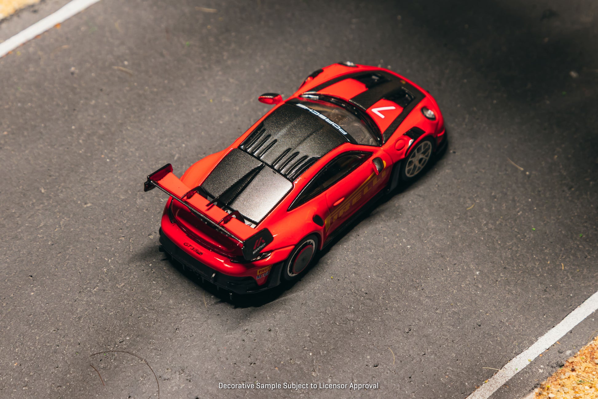 Tarmac Works Collab64 Porsche 911 GT3 RS Manthey Racing in red.