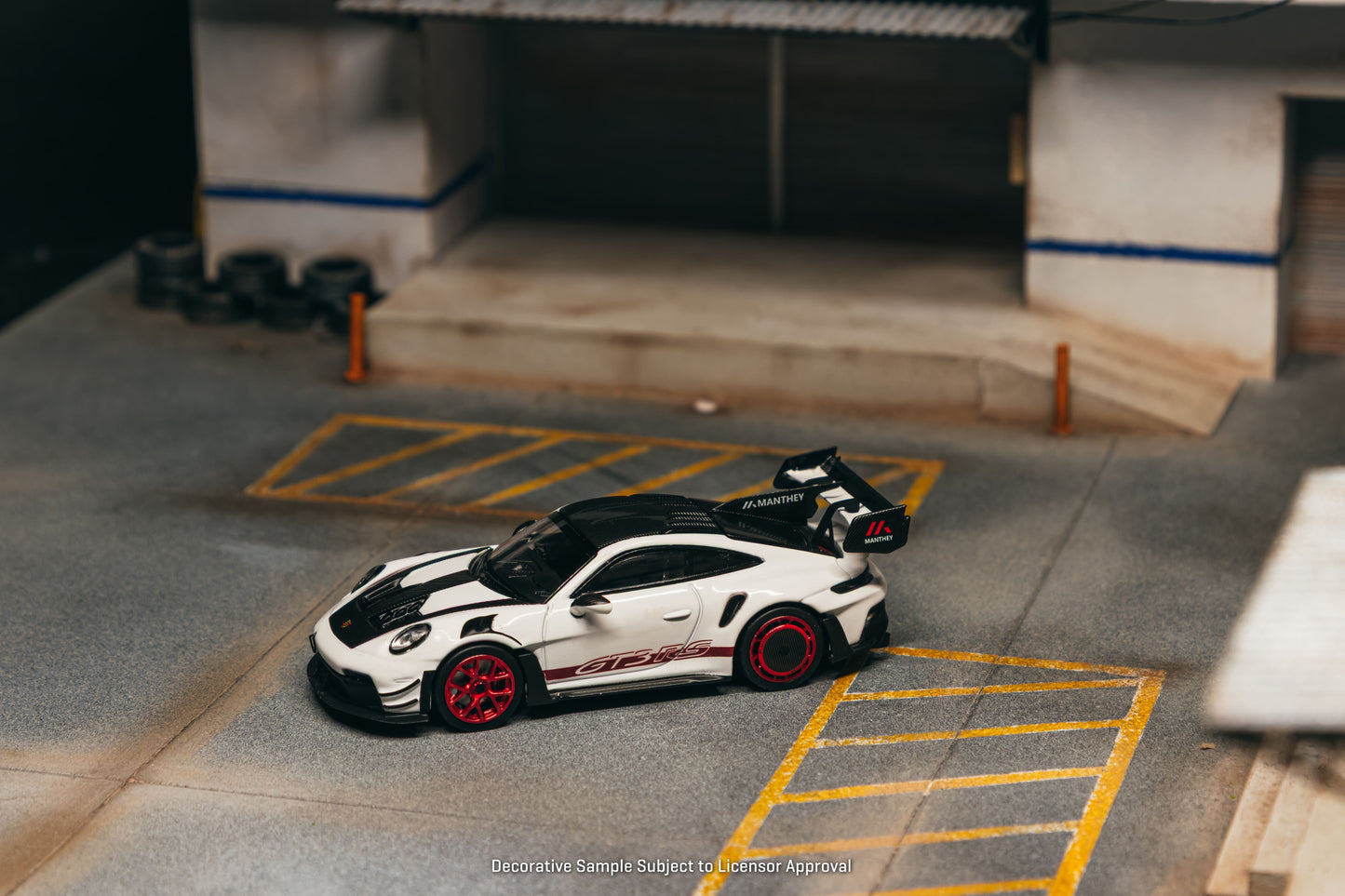 Tarmac Works Porsche 911 GT3 RS 992.1 MR in white and red from the Collab64 series. Side