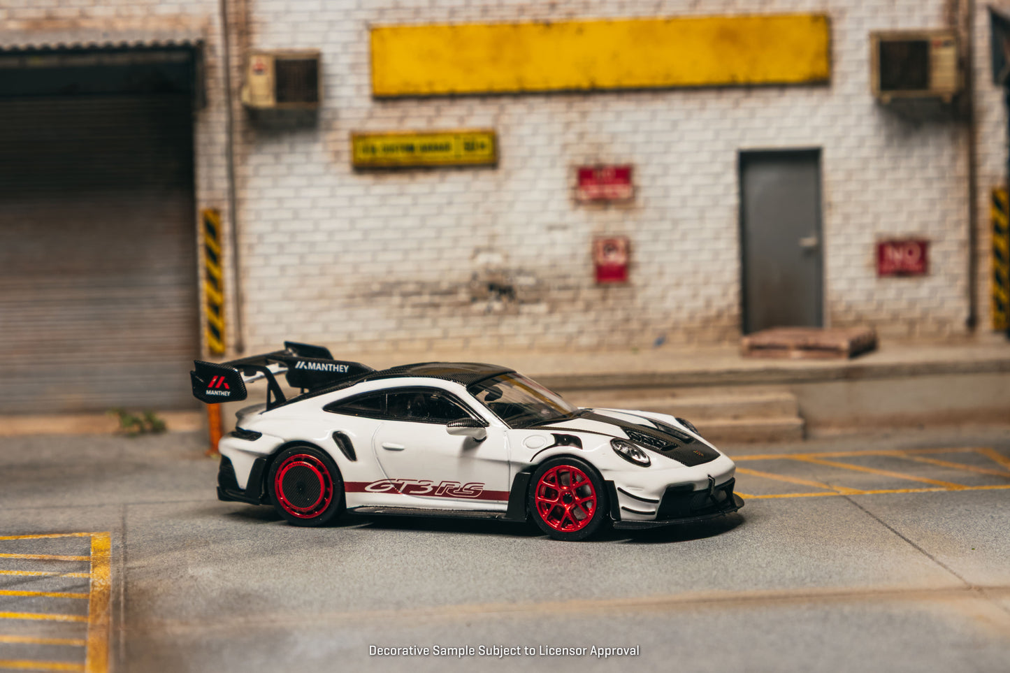 Tarmac Works Porsche 911 GT3 RS 992.1 MR in white and red from the Collab64 series. Side