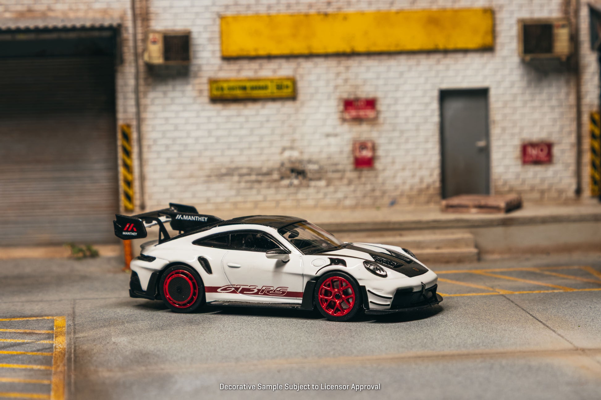 Tarmac Works Porsche 911 GT3 RS 992.1 MR in white and red from the Collab64 series. Side