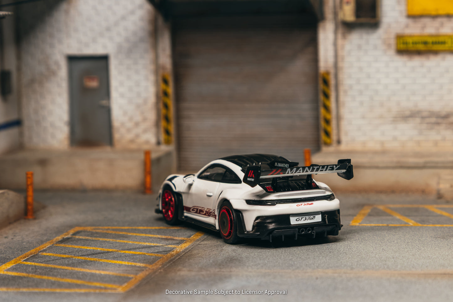 Tarmac Works Porsche 911 GT3 RS 992.1 MR in white and red from the Collab64 series. Back