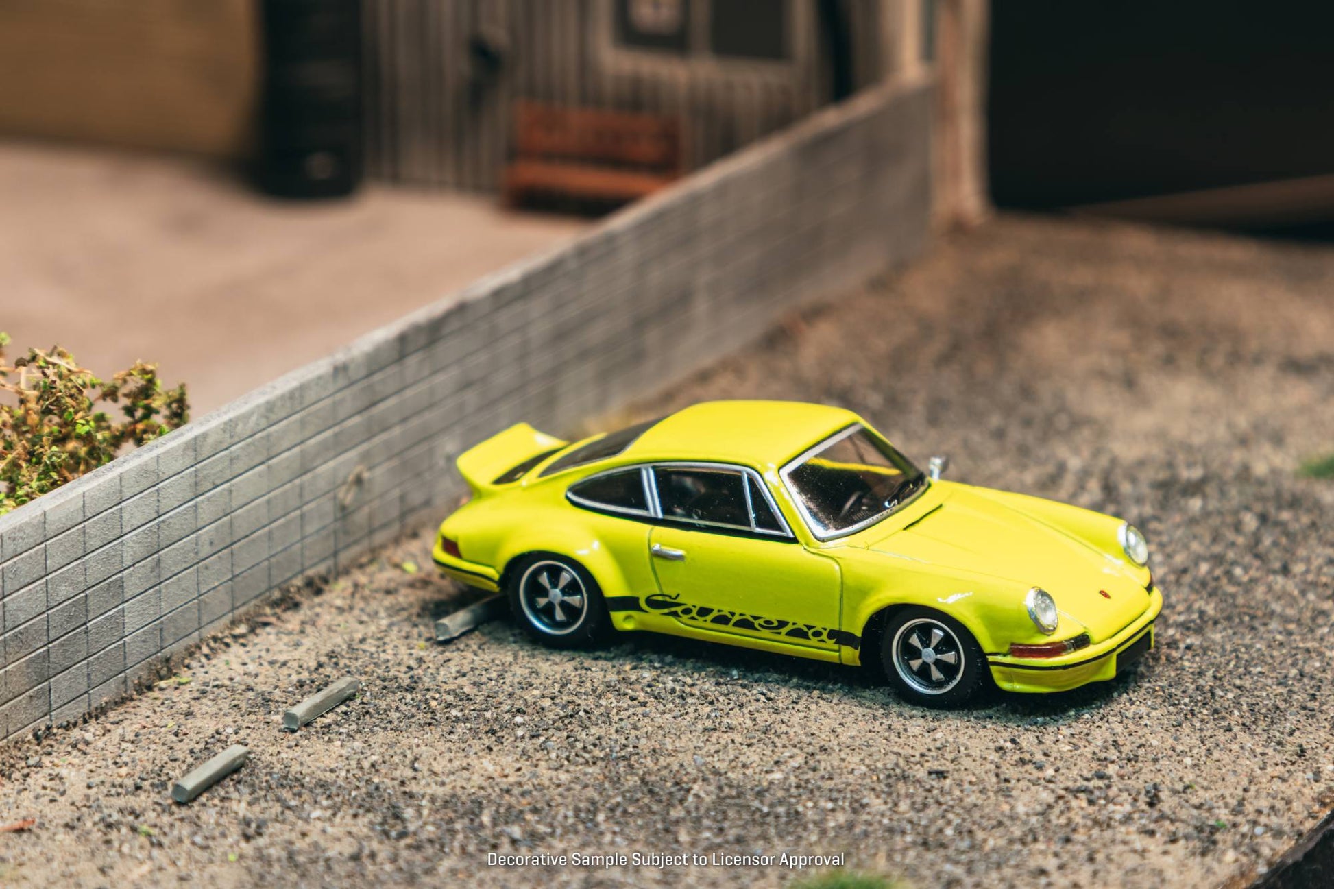 Tarmac Works 1:64 Porsche 911 Carrera RS 2.7 Lightweight yellow Schuco diecast model. Front