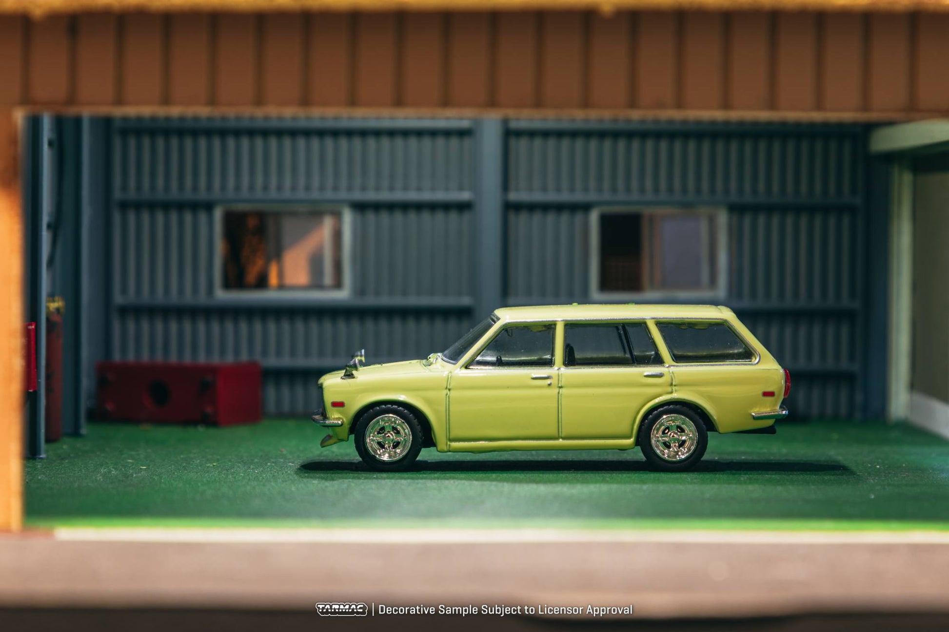 Tarmac Works 1:64 Datsun 510 Bluebird Wagon 1973 yellow diecast model. Side