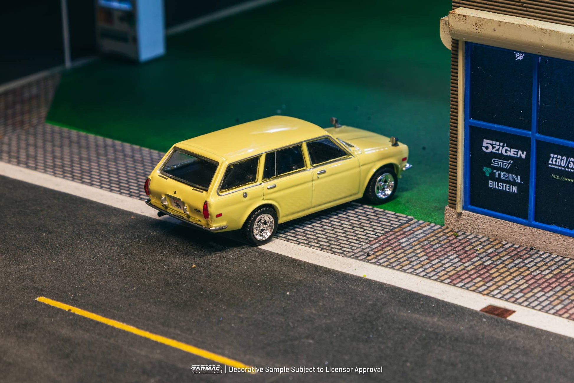 Tarmac Works 1:64 Datsun 510 Bluebird Wagon 1973 yellow diecast model. Back