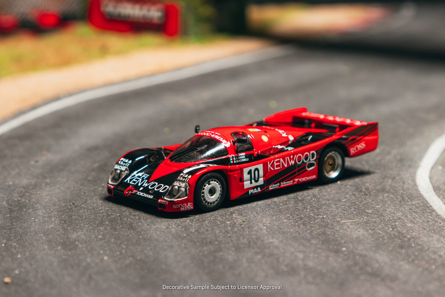 Tarmac Works 1:64 Porsche 962C #10 Kenwood Le Mans 1989 diecast model. Front