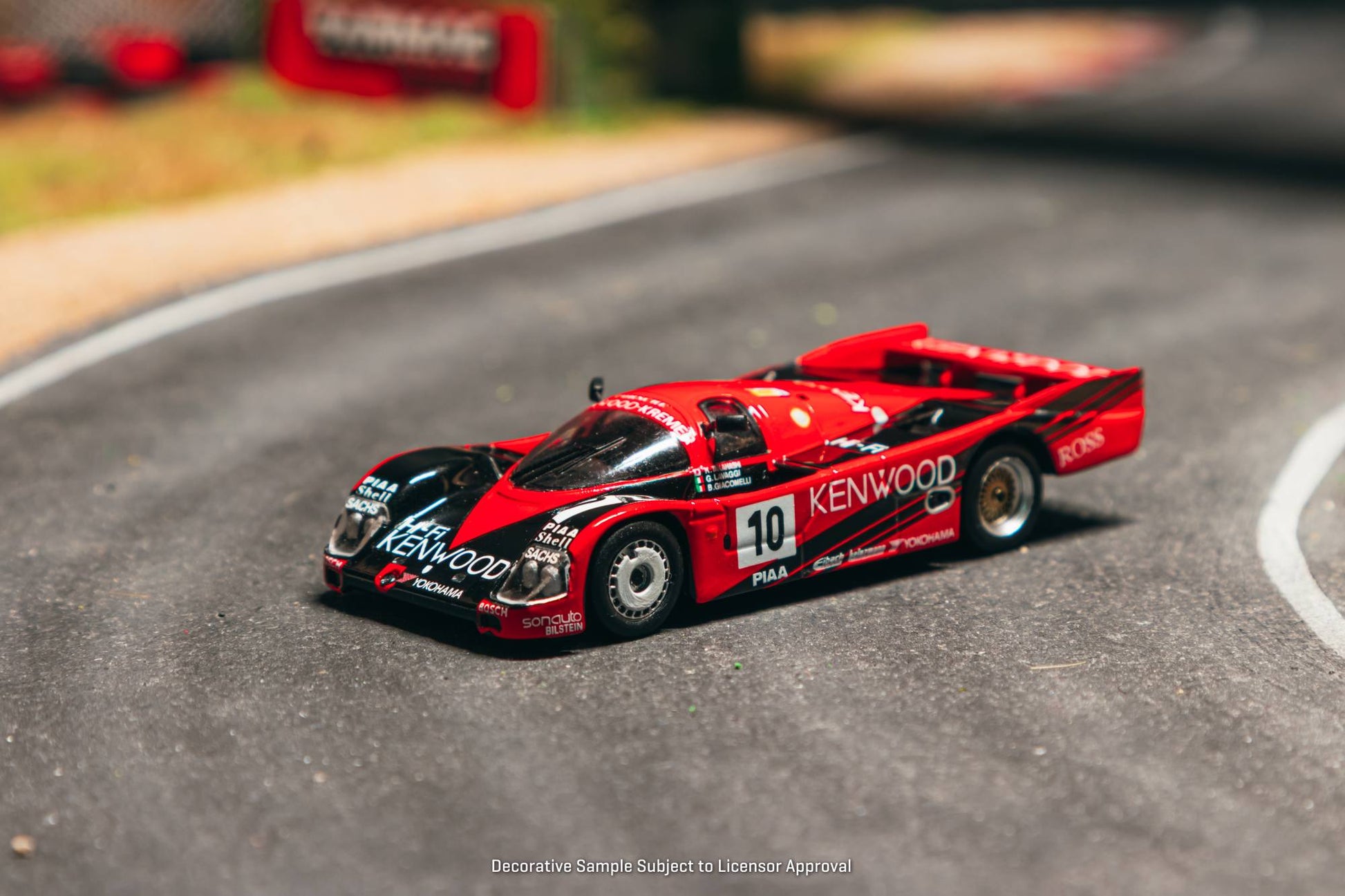 Tarmac Works 1:64 Porsche 962C #10 Kenwood Le Mans 1989 diecast model. Front