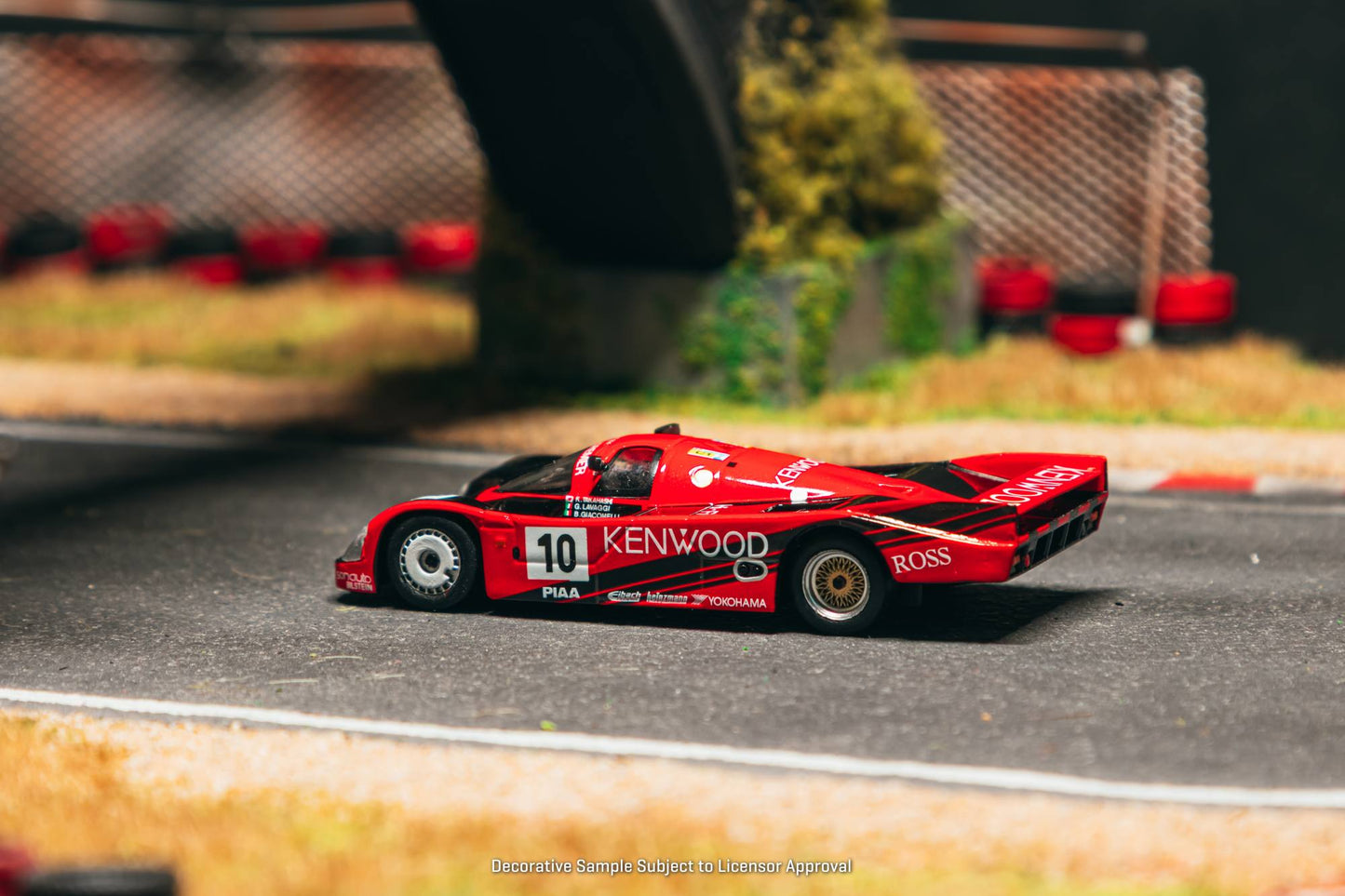 Tarmac Works 1:64 Porsche 962C #10 Kenwood Le Mans 1989 diecast model. Side