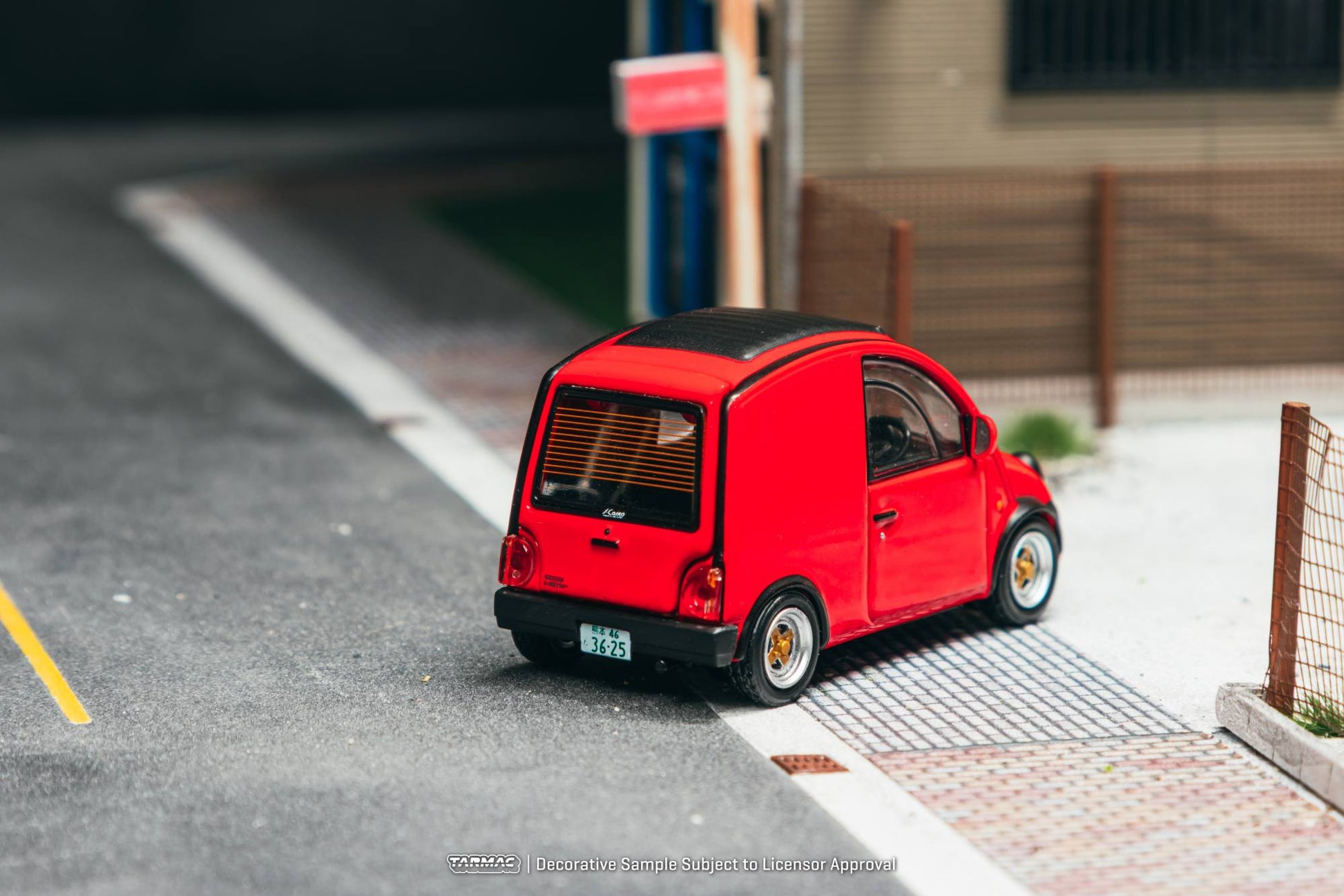 Tarmac Works 1:64 Nissan S Cargo 1995 red diecast model with movable rear door. Back