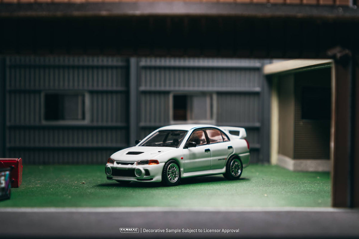 Tarmac Works 1996 Mitsubishi Lancer Evolution IV RS in white, a 1:64 Global64 diecast model.