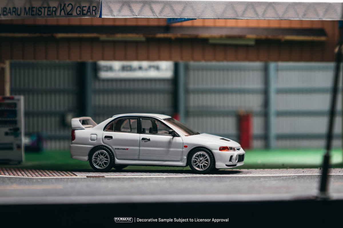 Tarmac Works 1996 Mitsubishi Lancer Evolution IV RS in white, a 1:64 Global64 diecast model.