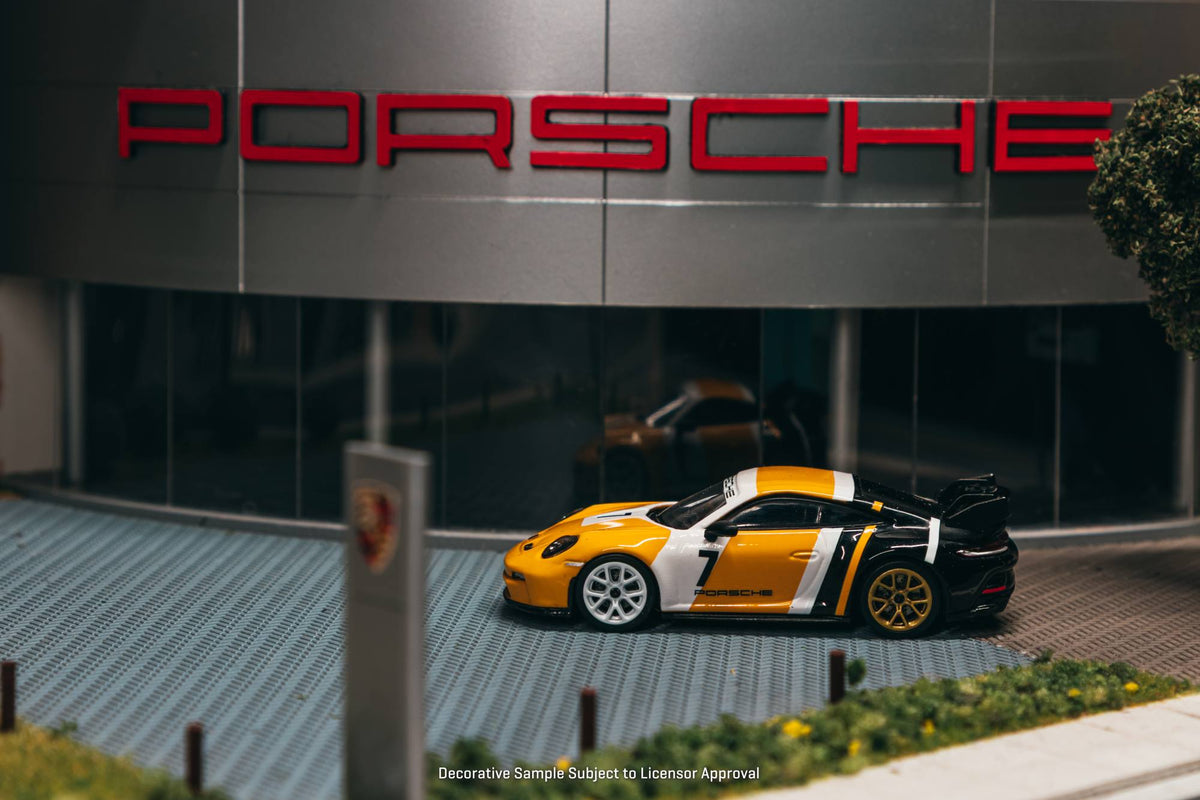Tarmac Works 2022 Porsche 911 992 GT3 in black and yellow, a 1:64 Collab64 diecast model.