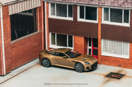 Tarmac Works 1:64 Aston Martin DBS Superleggera 2025 brown metallic luxury grand tourer diecast model. Side