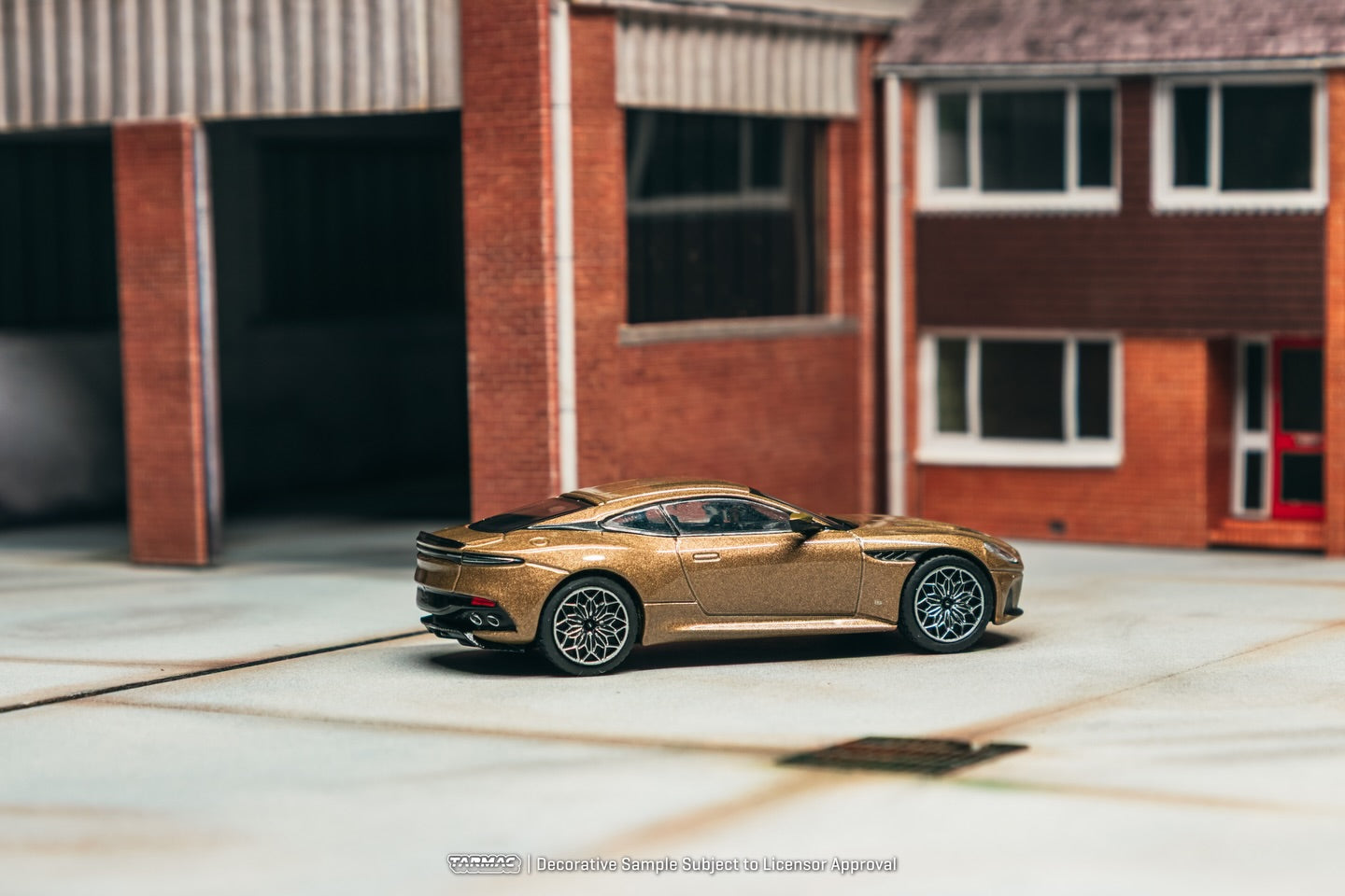 Tarmac Works 1:64 Aston Martin DBS Superleggera 2025 brown metallic luxury grand tourer diecast model. Back