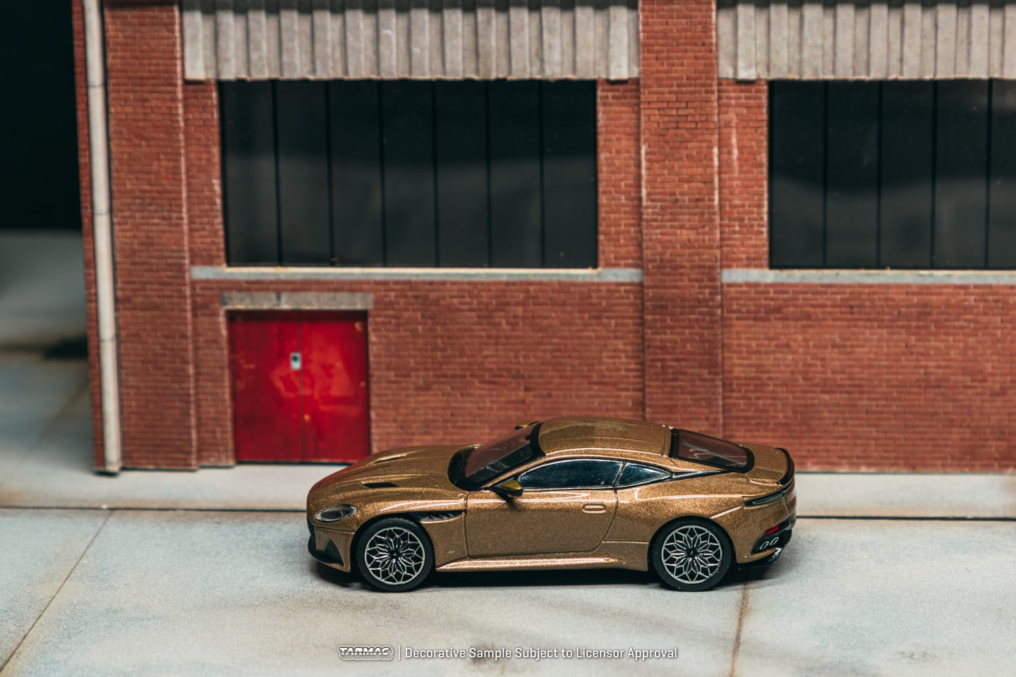 Tarmac Works 1:64 Aston Martin DBS Superleggera 2025 brown metallic luxury grand tourer diecast model. Top