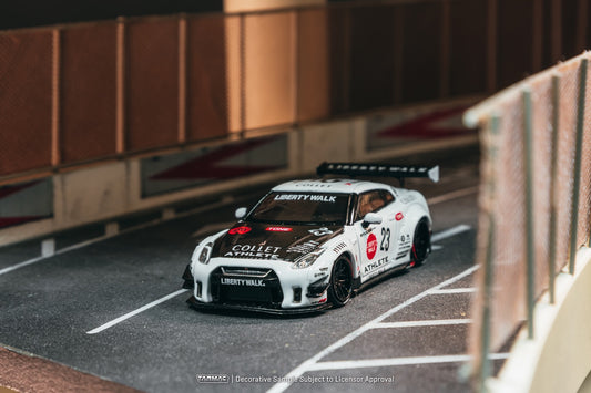 Tarmac Works 1:64 Nissan GT-R R35 LB Works Type 2 white Athlete X Collect oil can edition with display case. Front