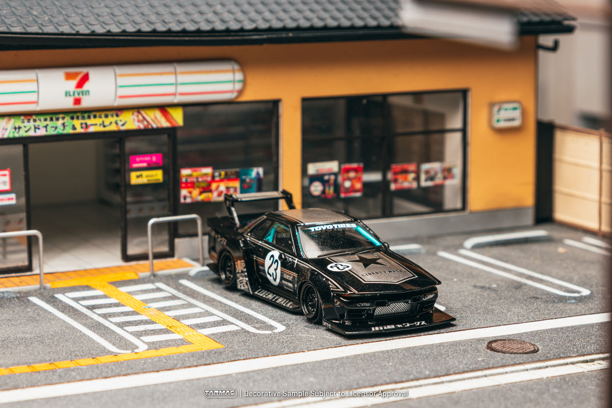 Tarmac Works 2025 Nissan Skyline R32 LB-Kaido Works in black, a widebody 1:64 Hobby64 collector model.