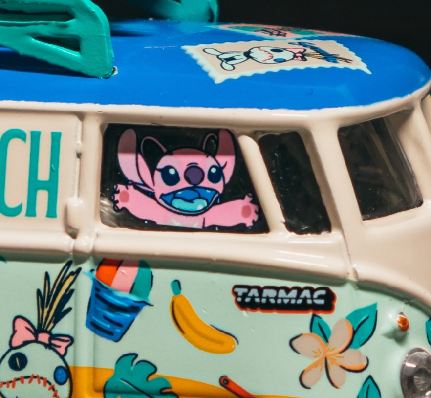 Tarmac Works 2025 Volkswagen Transporter T1 Panel Van Lilo & Stitch, a 1:64 Hobby64 model in an acrylic display case.