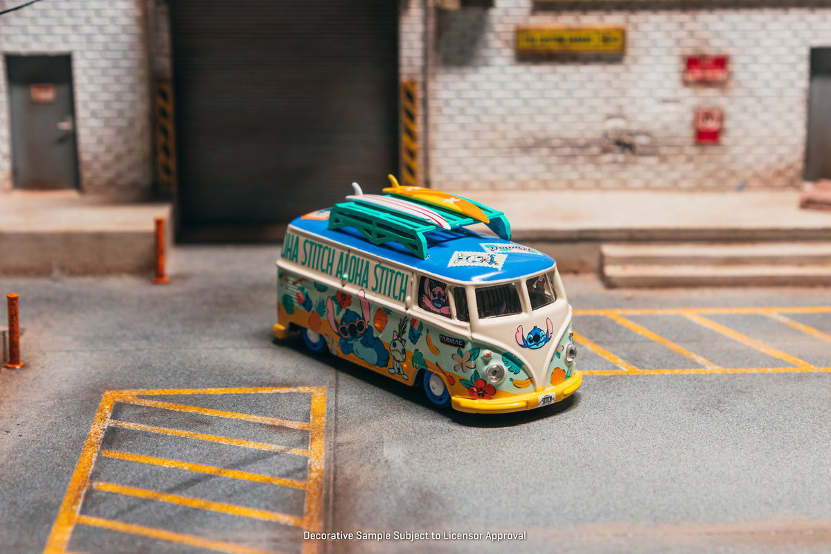 Tarmac Works 2025 Volkswagen Transporter T1 Panel Van Lilo & Stitch, a 1:64 Hobby64 model in an acrylic display case.