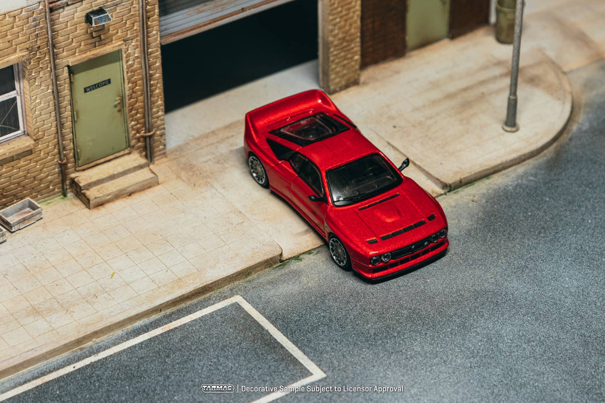 Tarmac Works 2026 Kimera EVO38 in red, a 1:64 Global64 diecast model inspired by Italian rally heritage.