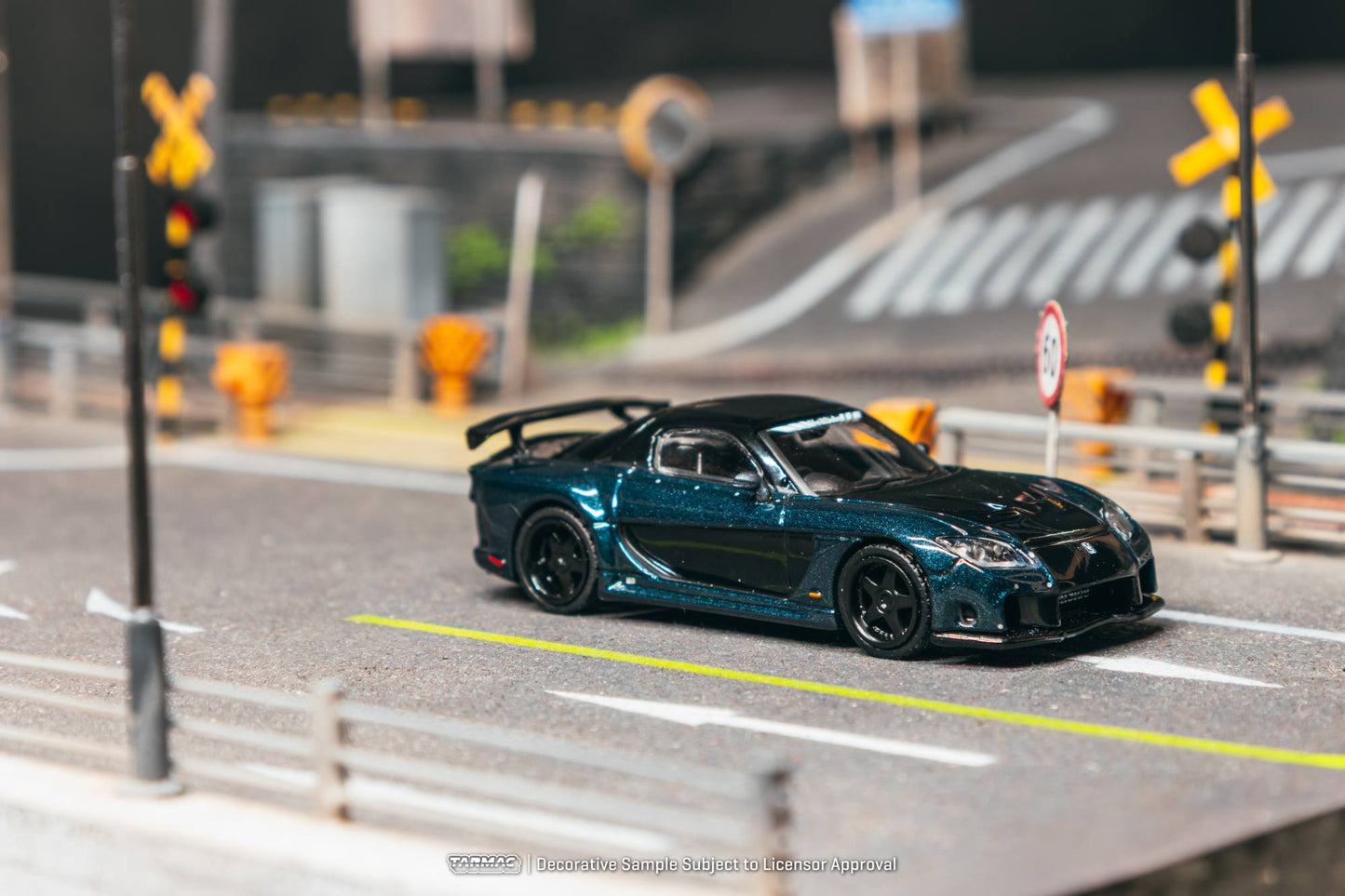 Tarmac Works 1:64 Mazda RX-7 FD VeilSide Fortune dark blue black diecast model. Side