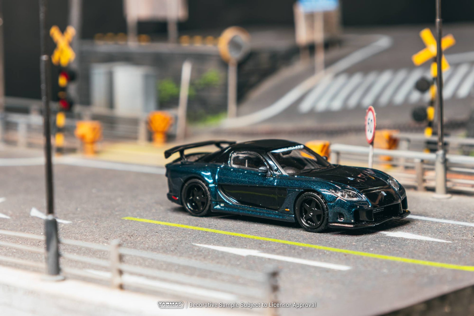 Tarmac Works 1:64 Mazda RX-7 FD VeilSide Fortune dark blue black diecast model. Side