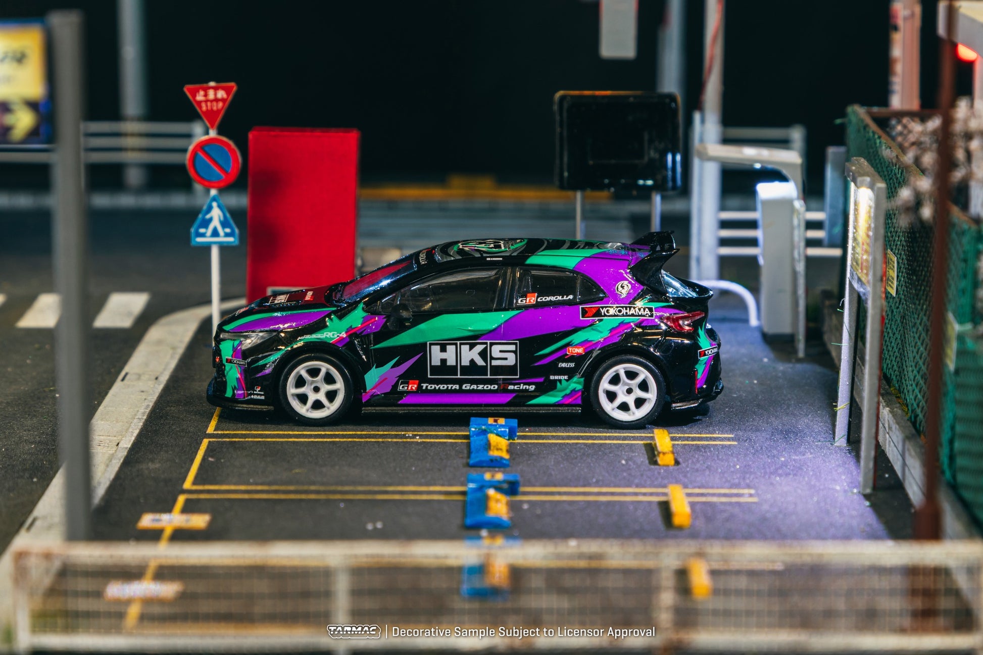1:64 scale Tarmac Works HKS Toyota GR Corolla with iconic oil splash livery and widebody styling.