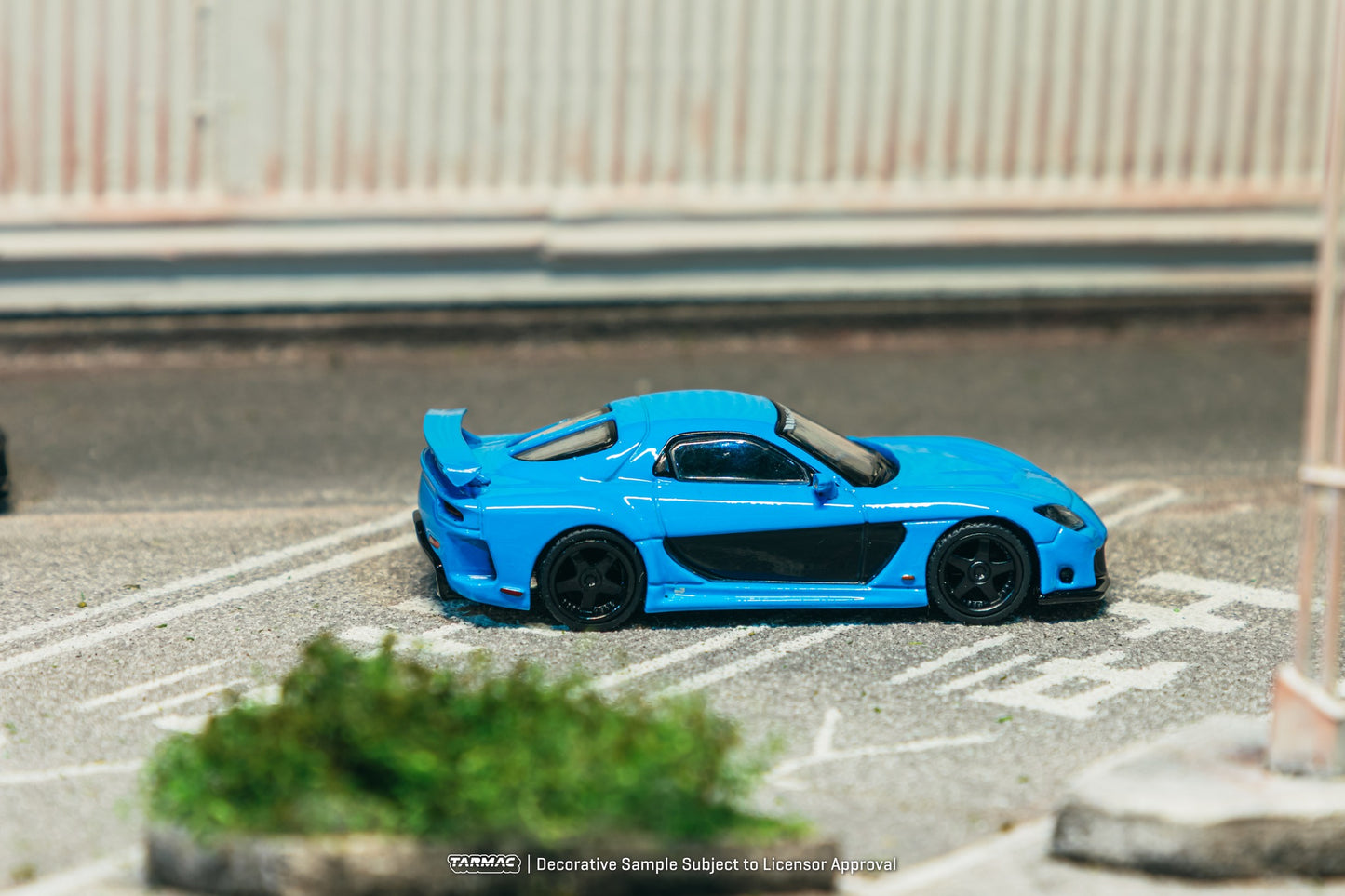 1:64 Tarmac Works Mazda RX-7 VeilSide Fortune7 in baby blue, widebody kit, VeilSide logos, detailed rims and headlights, pre-order collectible model. Side
