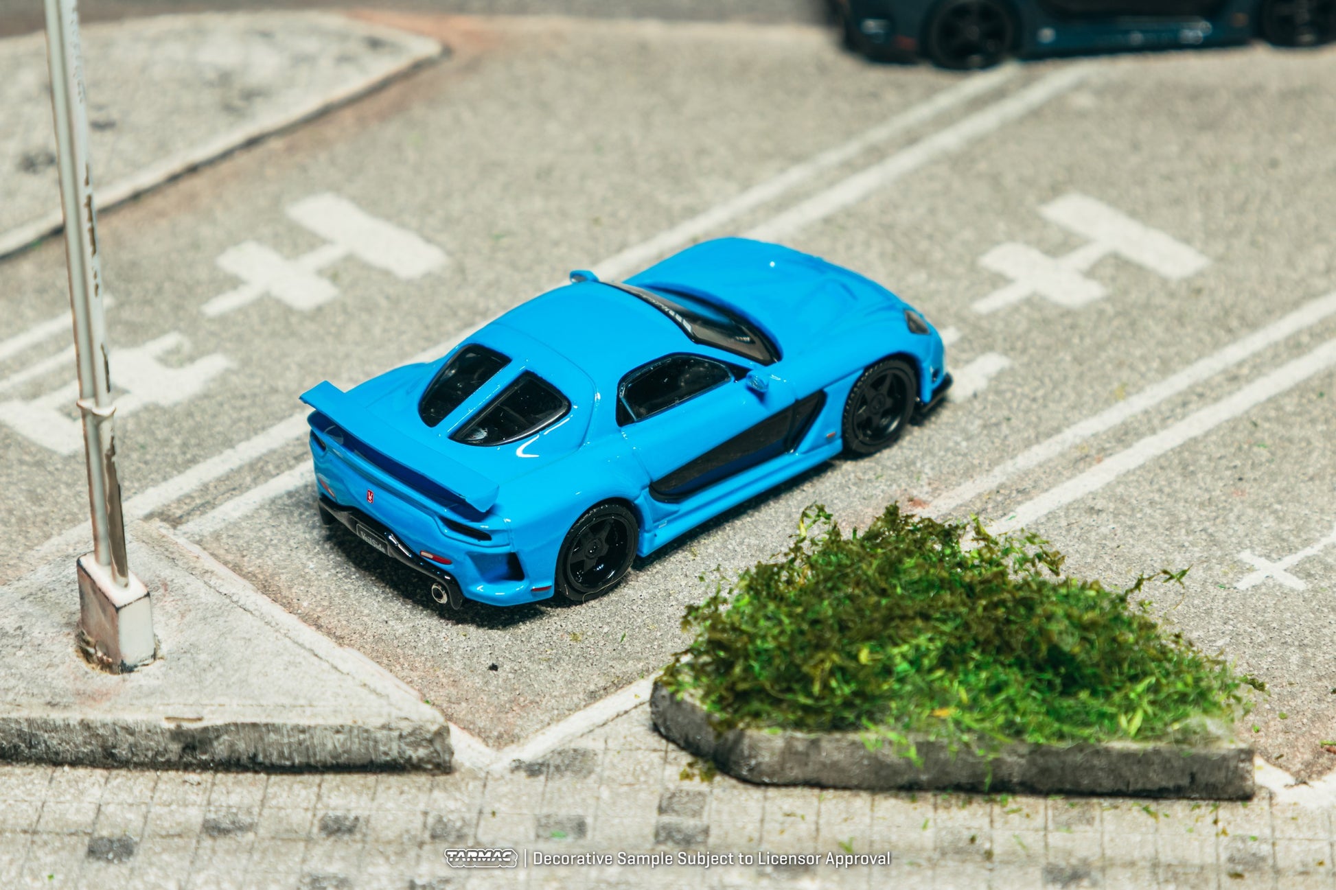 1:64 Tarmac Works Mazda RX-7 VeilSide Fortune7 in baby blue, widebody kit, VeilSide logos, detailed rims and headlights, pre-order collectible model. Top
