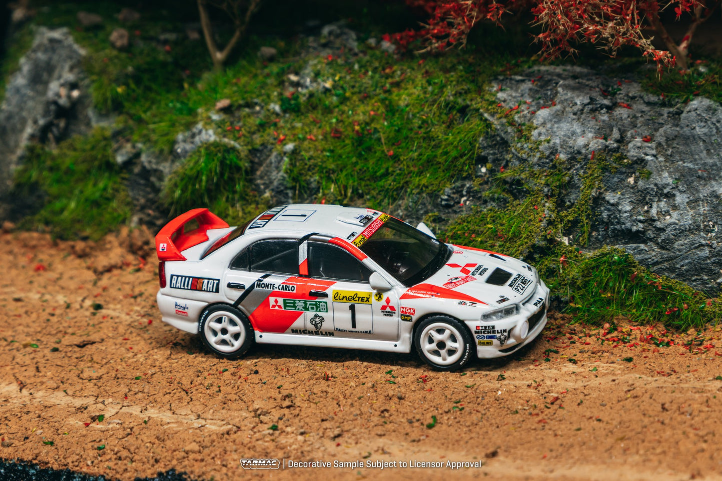 Tarmac Works Mitsubishi Lancer Evolution IV #1 Monte Carlo Rally 1997 diecast car in red WRC livery. Side