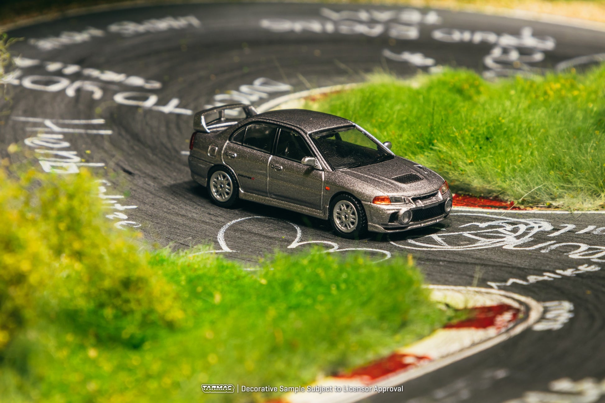 Tarmac Works Mitsubishi Lancer Evolution IV in silver. Front