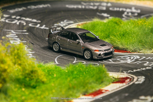 Tarmac Works Mitsubishi Lancer Evolution IV in silver. Front