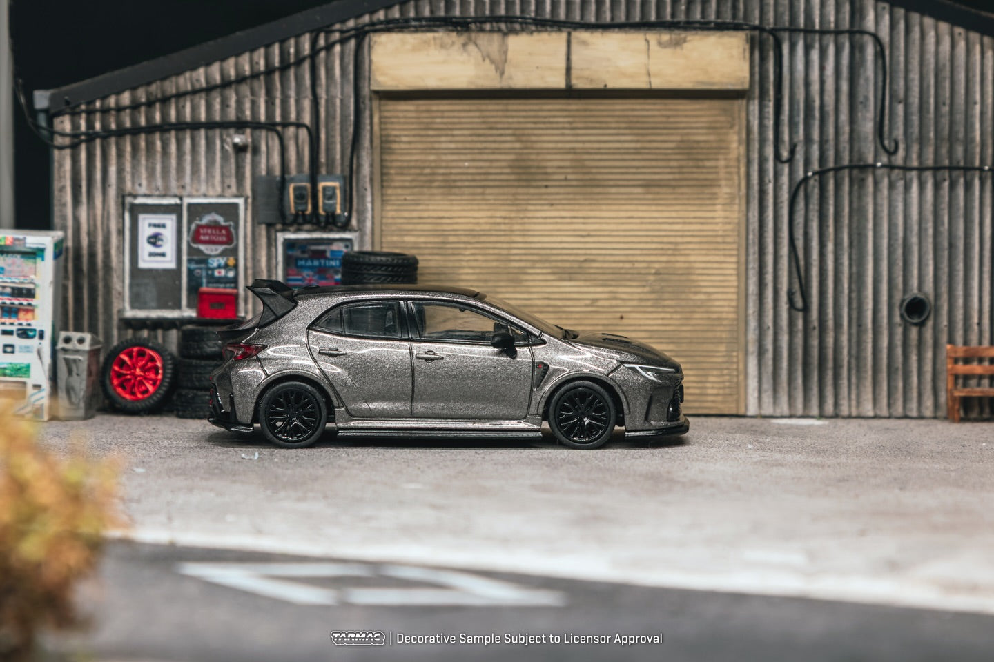 Tarmac Works Toyota GR Corolla grey aero oil can packaging diecast 1:64. Side