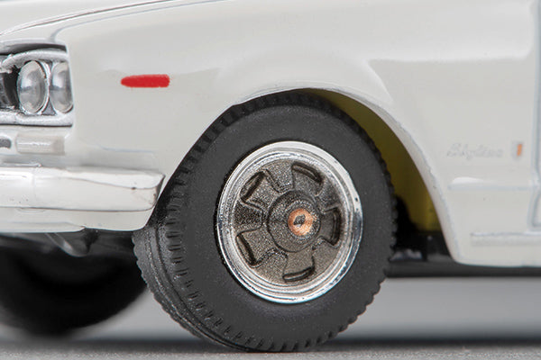 Tomica Limited Vintage 1972 Nissan Skyline 2000 GT-X four-door sedan in White, detailed Hakosuka 1:64 model.