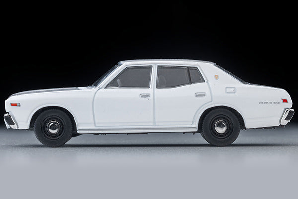 Tomica Limited Vintage 1978 Nissan Cedric Standard four-door sedan in White, detailed 330-series 1:64 model.