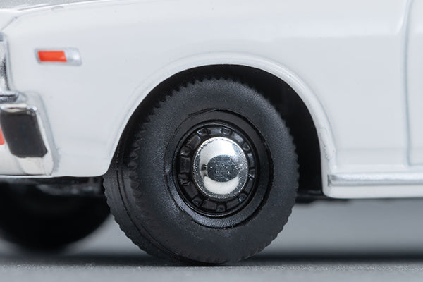 Tomica Limited Vintage 1978 Nissan Cedric Standard four-door sedan in White, detailed 330-series 1:64 model.