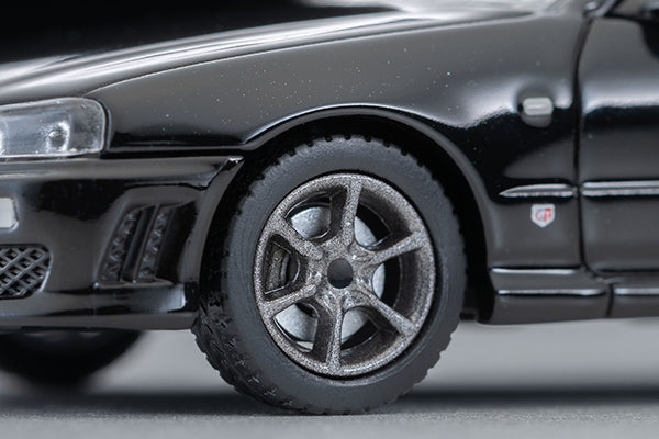 Tomica Limited Vintage 2000 Nissan Skyline 25GT Turbo ER34 in Black with interchangeable exterior parts and rear spoiler options.