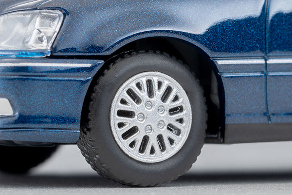 Tomica Limited Vintage 2000 Toyota Crown Estate Royal Saloon in navy blue with detailed front grille and headlights.