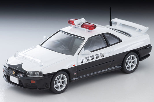 Tomica Limited Vintage Nissan Skyline ER34 25GT Turbo 2-door police car with GT-R badge and patrol equipment.
